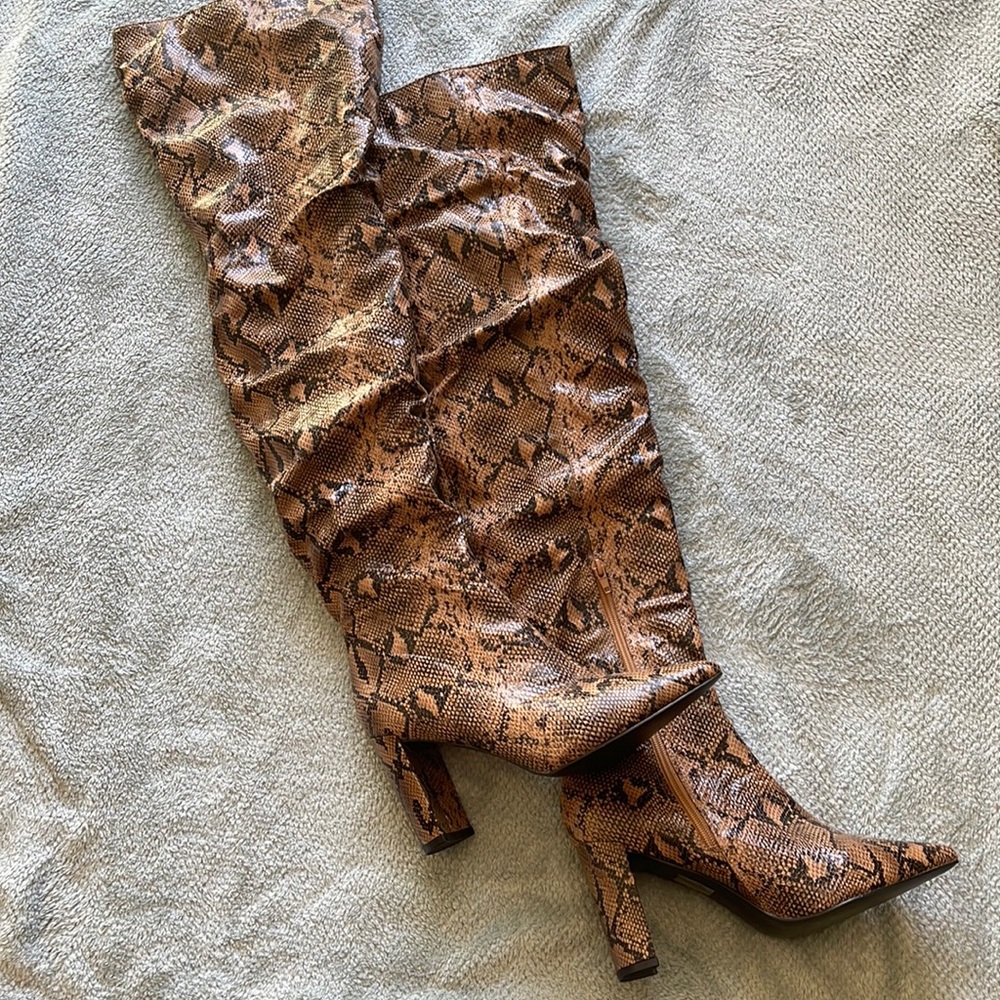 Thigh high brown snakeskin boots